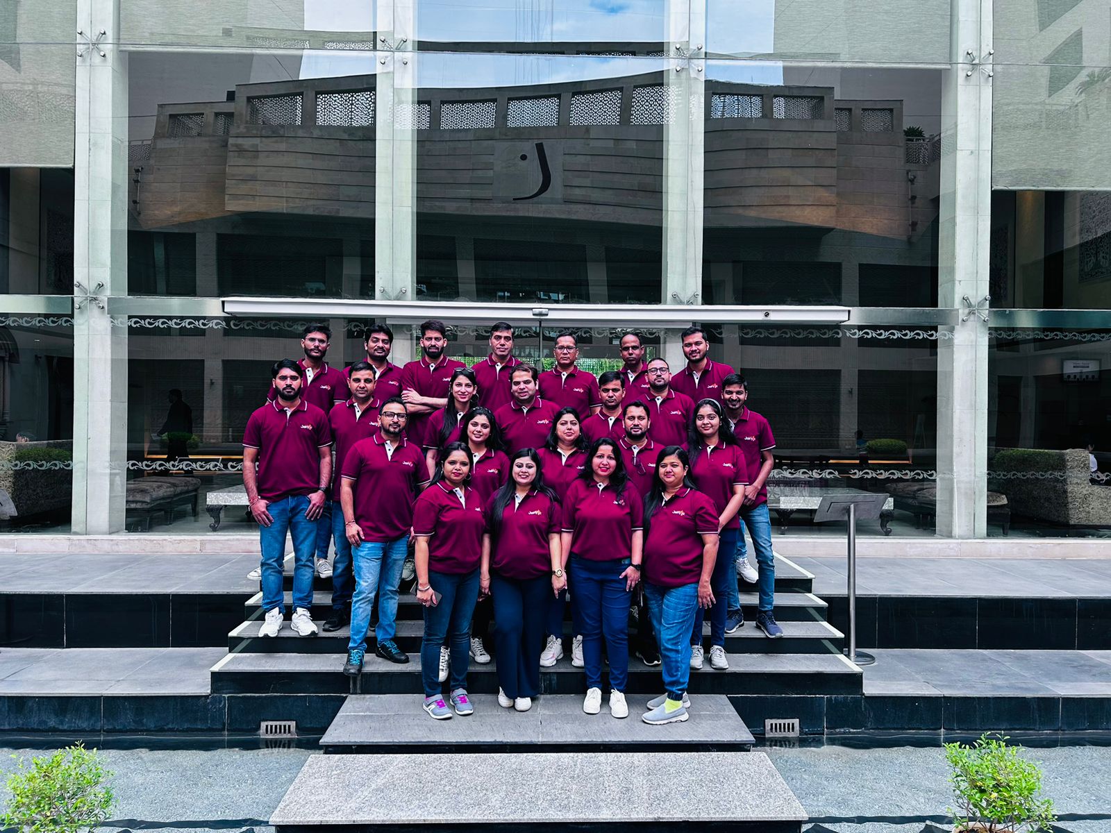 Jainytic team posing together outside a hotel during their corporate trip to Jaipur